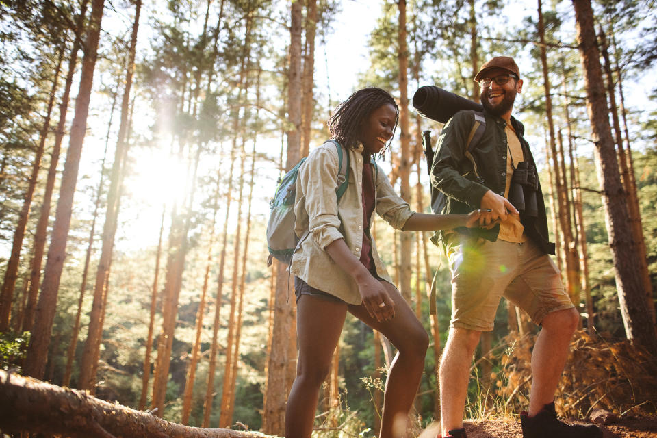 a couple hiking in the woods