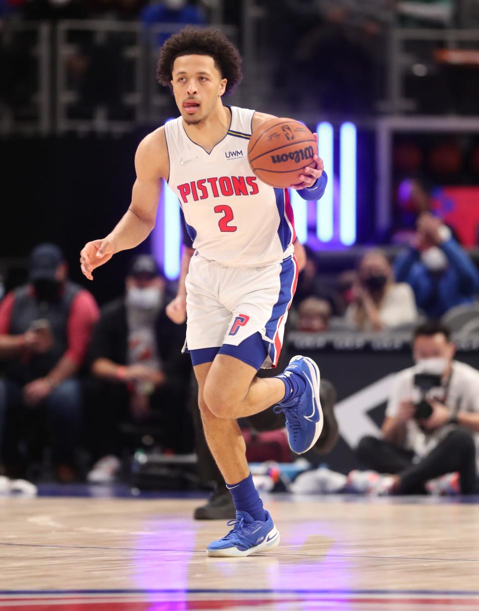 Detroit Pistons guard Cade Cunningham brings the ball up court against the Denver Nuggets on Tuesday, Jan. 25, 2022 at Little Caesars Arena.