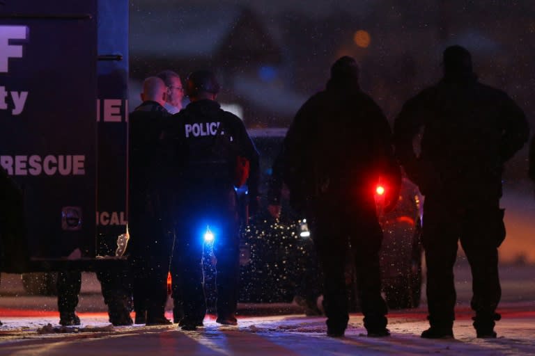 A suspect is led away in handcuffs by police following a shooting which left three people dead and nine wounded at a Planned Parenthood facility on November 27, 2015 in Colorado Springs, Colorado