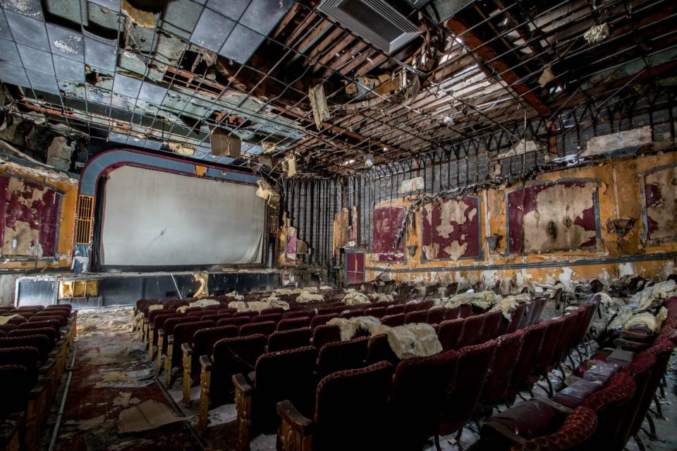 <p>Red, tattered seats still occupy this former movie theater. <br></p><p>Photo: Flickr/<a href="https://www.flickr.com/photos/downloadthis/32571814853/in/photolist-RCg4LH-9fTudq-nwcHpV-vTm52-vTpnr-QR4Nco-6vHN9y-cdqy9S-pNYNzZ-21q1zei-eht7xH-gdVHJ7-eht71k-eht7wc-q5pdcV-a8kXHF-8WXHA2-a8kY16-87LeWE-6zhFk4-6zmBJ7-4w464L-5z76tH-5re9SH-dGQt4k-9LM9QW-BseS2w-nwuFBB-95r9u5-6BKvm3-pVueRK-be28t6-8X1JNo-vTp5i-vTpeC-vToo4-vTmvC-KtcPV-6zh3UK-a9NUqM-vTpLa-87fVTY-9zYmH6-6zmxWC-6zmfZj-5BdwWc-6zmaQQ-6zhBtX-pb5iCy-9LJmCv" rel="nofollow noopener" target="_blank" data-ylk="slk:Phillip;elm:context_link;itc:0;sec:content-canvas" class="link ">Phillip</a></p>