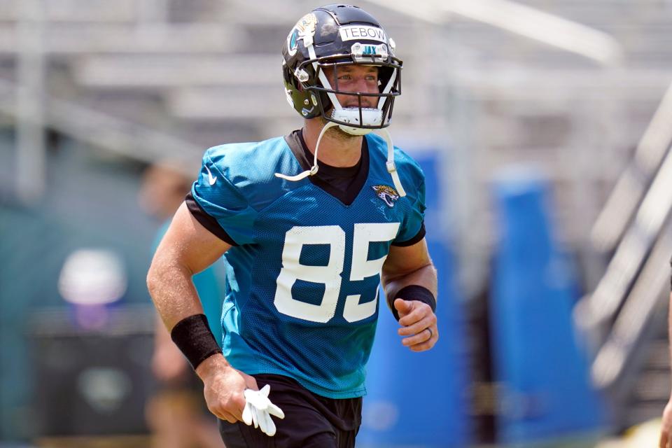 Jacksonville Jaguars tight end Tim Tebow runs on the field during an NFL football team practice, Thursday, May 27, 2021, in Jacksonville, Fla. (AP Photo/John Raoux)