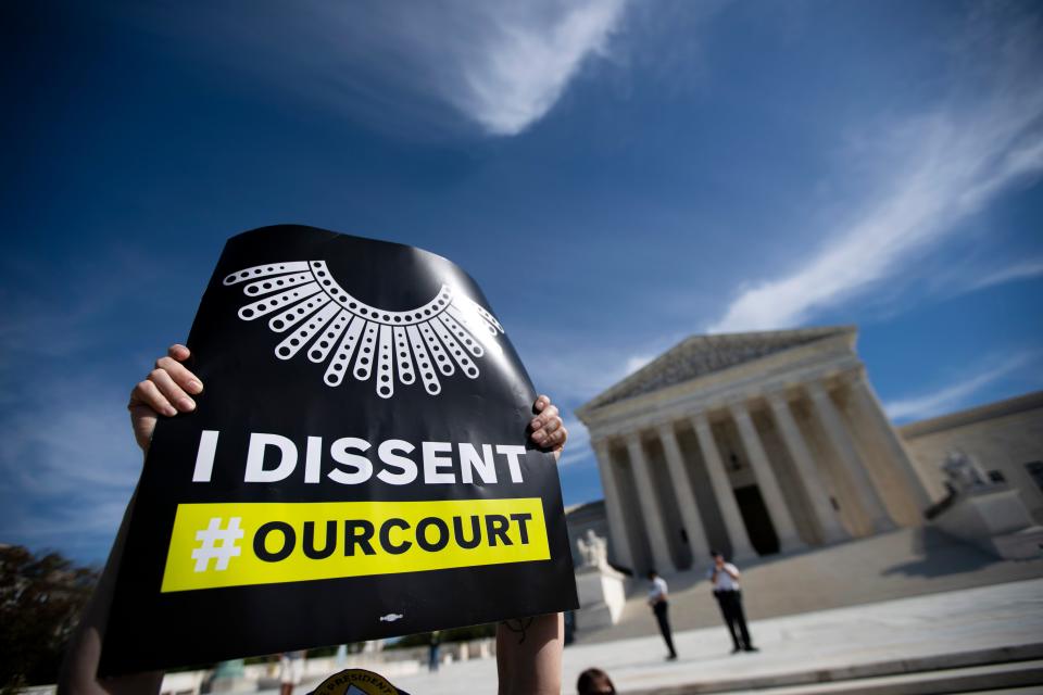 Protesters opposed to the confirmation of President Donald Trump's Supreme Court nominee Amy Coney Barrett rally at the Supreme Court on Oct. 14.