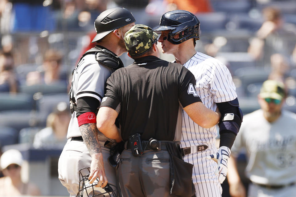 NEW YORK, NEW YORK - MAY 21: umpire Nick Mahrley #48 attempts to separate Yasmani Grandal #24 of the Chicago White Sox and Josh Donaldson #28 of the New York Yankees during the fifth inning at Yankee Stadium on May 21, 2022 in the Bronx borough of New York City. (Photo by Sarah Stier/Getty Images)