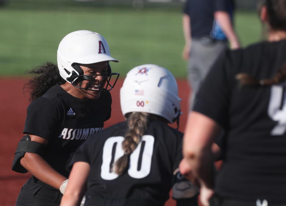 Assumption’s Maleya Giddens hits a home run against Ballard on Thursday.