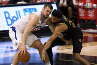 Los Angeles Clippers center Ivica Zubac (40) works in against Toronto Raptors center Khem Birch (24) during the second half of an NBA basketball game Tuesday, May 11, 2021, in Tampa, Fla. (AP Photo/Chris O'Meara)