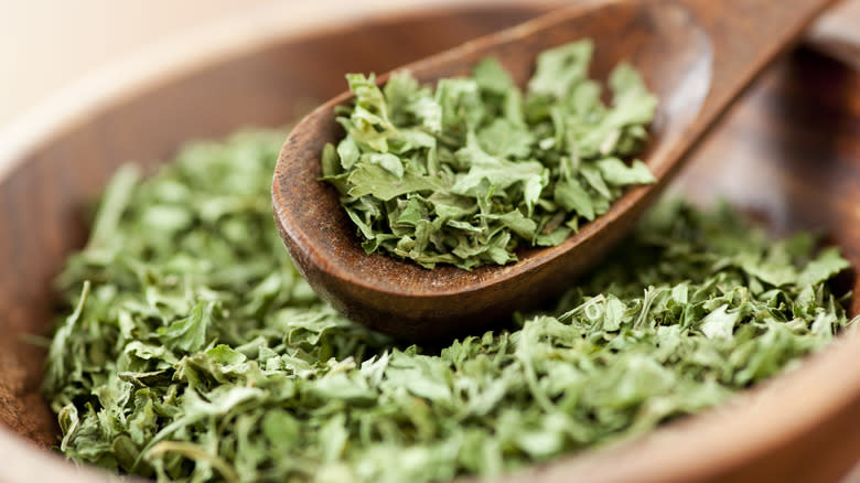 dried parsley flakes on spoon