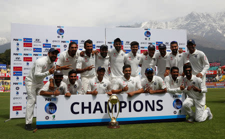 Cricket - India v Australia - Fourth Test cricket match - Himachal Pradesh Cricket Association Stadium, Dharamsala - 28/03/17 - Indian players pose with the trophy after winning the series. REUTERS/Adnan Abidi