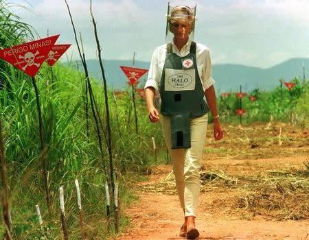 FILE PHOTO: Diana, Princess of Wales is seen in this January 15 1997 file picture walking in one of the safety corridors of the land mine fields of Huambo, Angola during her visit to help a Red Cross campaign to outlaw landmines worldwide. January 15, 1997. REUTERS/Files