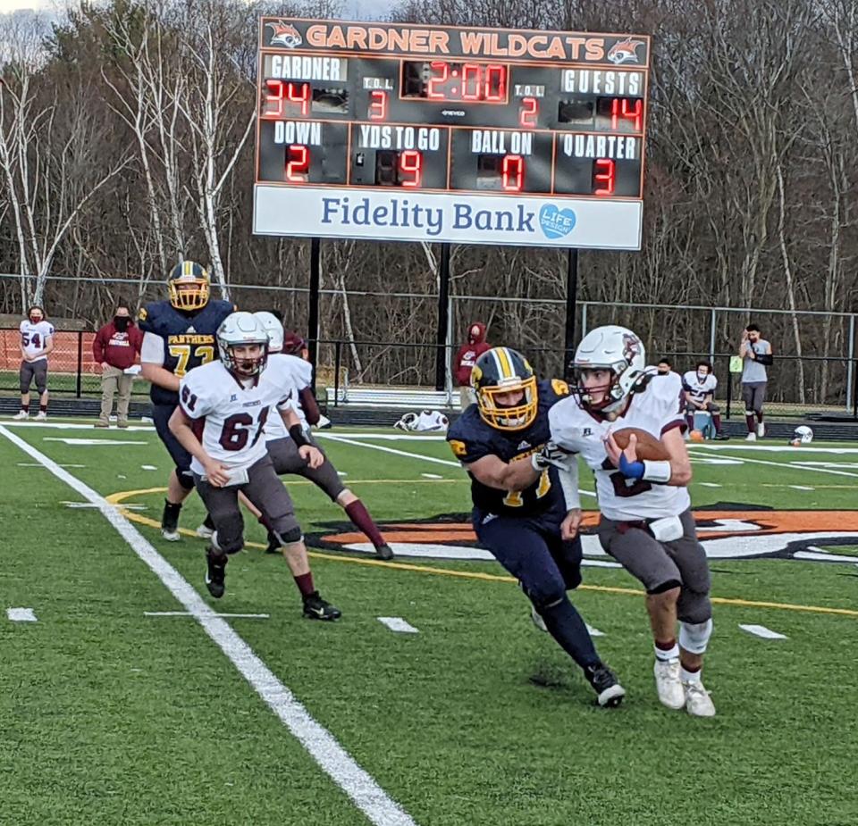 Quabbin defensive lineman Jake Leazott catches Ayer-Shirley quarterback Brian Holmes from behind for a sack.