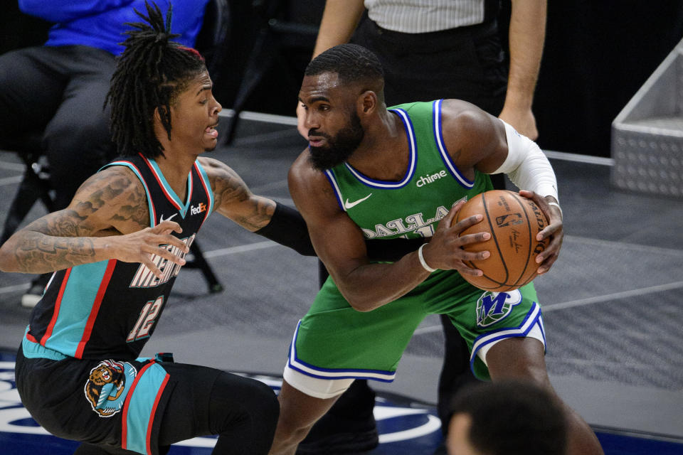 Feb 22, 2021; Dallas, Texas, USA; Memphis Grizzlies guard Ja Morant (12) defends against Dallas Mavericks forward Tim Hardaway Jr. (11) during the second half at the American Airlines Center. 