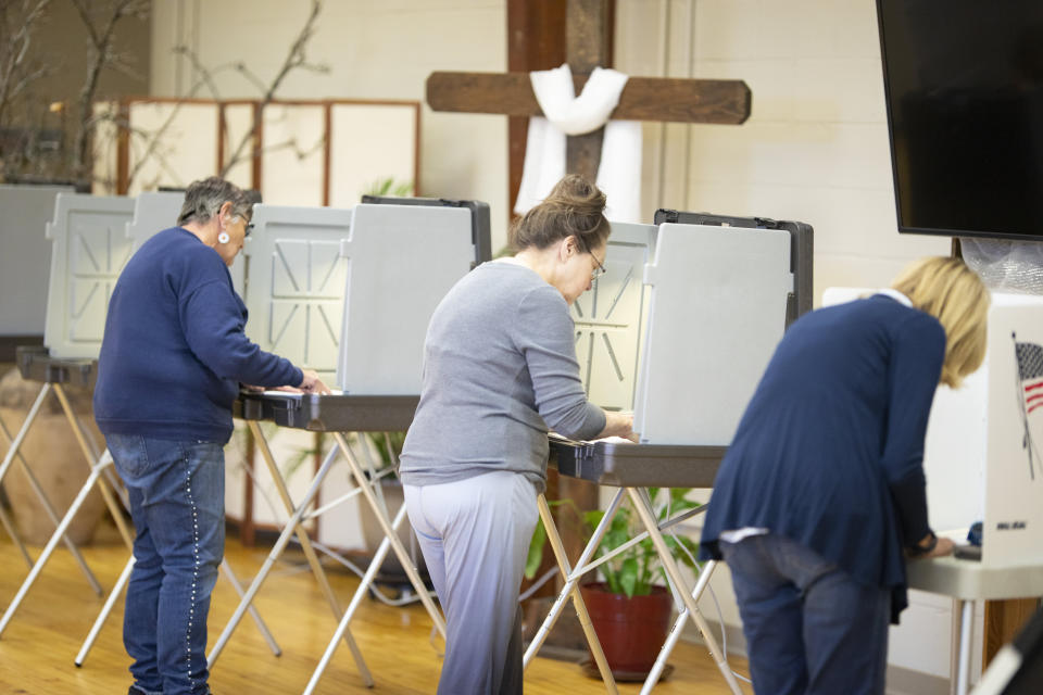 Voters cast their ballots in Idaho's Primary Election at Catholic Hall on Tuesday, May 17, 2022, in Emmett, Idaho. (AP Photo/Kyle Green)