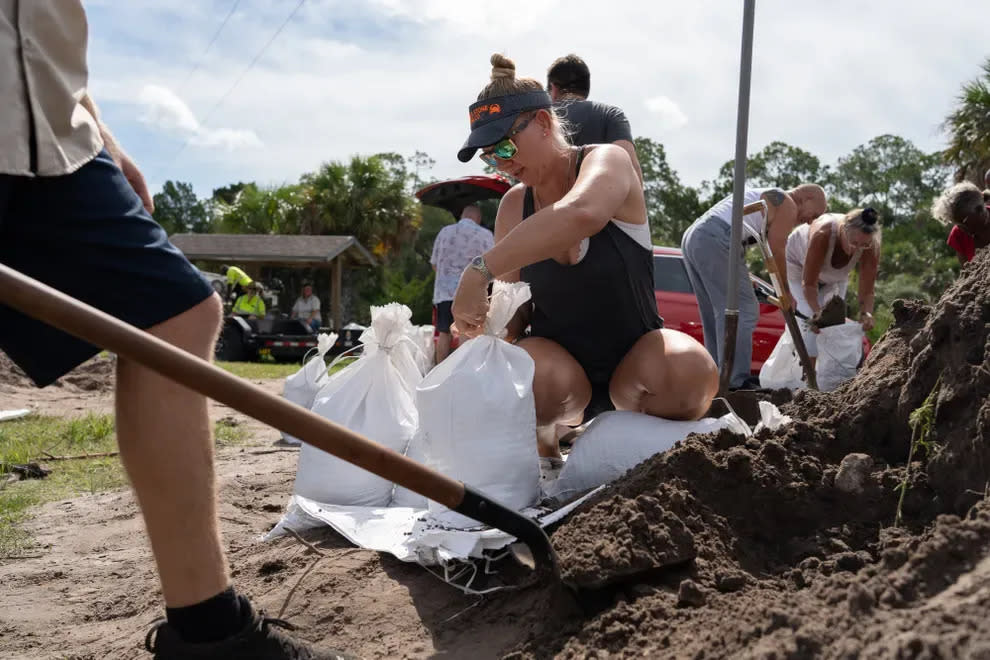 As Hurricane Idalia approached in the Gulf on Aug. 29, many residents made sandbags to protect their homes and businesses from floodwaters, including Karri Holliday, of Aripeka, at this free site in Spring Hill.