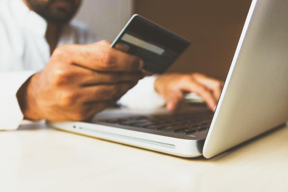 Man making online payment with card