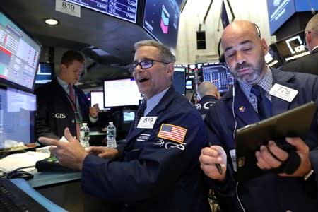 Traders work on the floor at the NYSE in New York