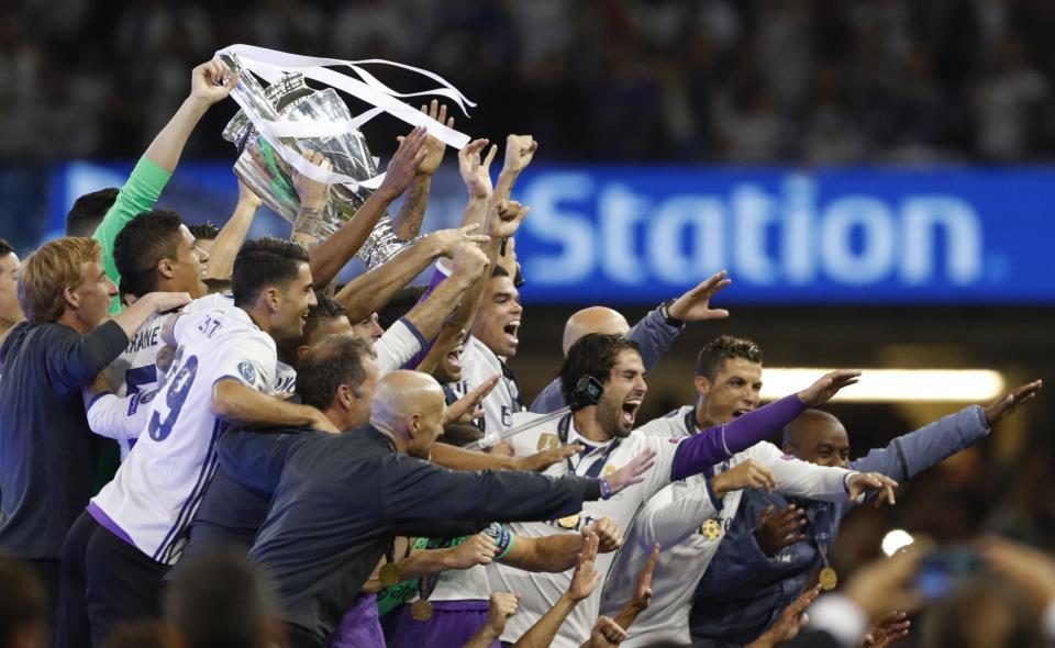 <p>Sergio Ramos of Real Madrid lifts The Champions League trophy after the UEFA Champions League Final between Juventus and Real Madrid at National Stadium of Wales on June 3, 2017 in Cardiff, Wales. </p>