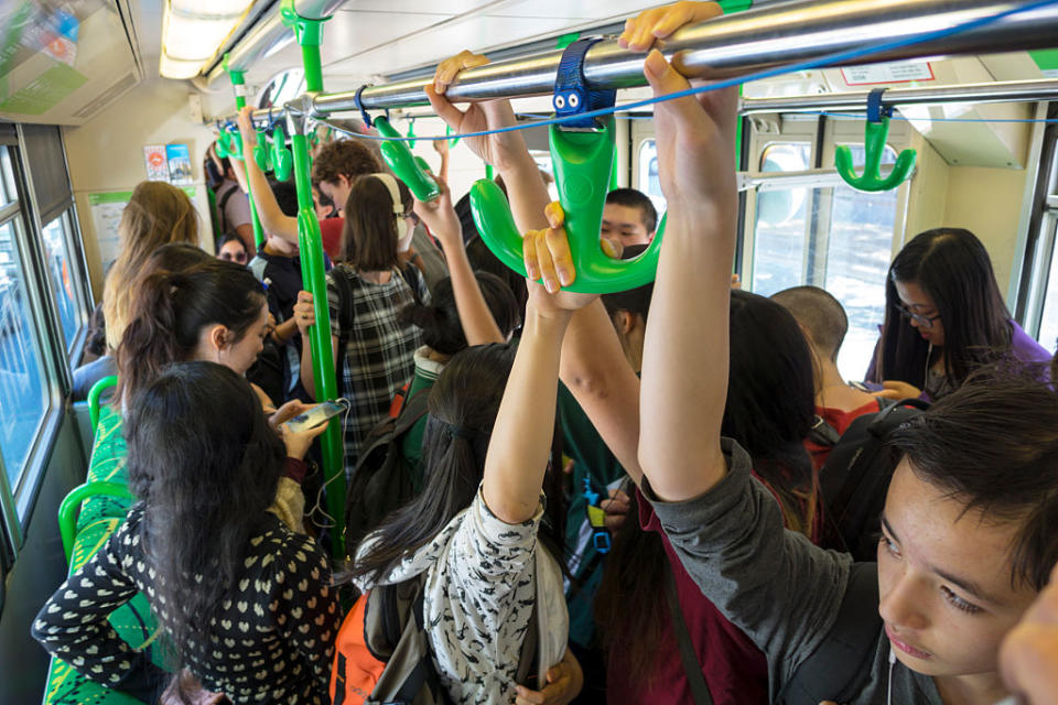 A crowd of people are seen on a tram in Melbourne's CBD. Source: Getty