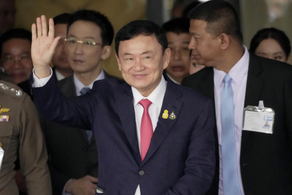 FILE - Thailand's former Prime Minister Thaksin Shinawatra, center, arrives at Don Muang airport in Bangkok, Thailand, on Aug. 22, 2023. Thaksin is stressed but in good spirits, his daughter Paetongtarn Shinawatra said Tuesday, Aug. 29, in the latest update on his health since he went into a police general hospital last week. (AP Photo/Sakchai Lalit, File)