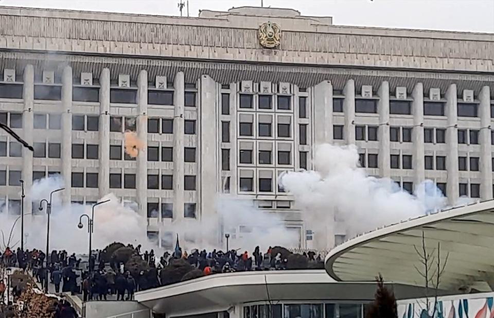 Protesters near the Almaty mayor’s office during a rally over a hike in energy prices (AFP via Getty Images)