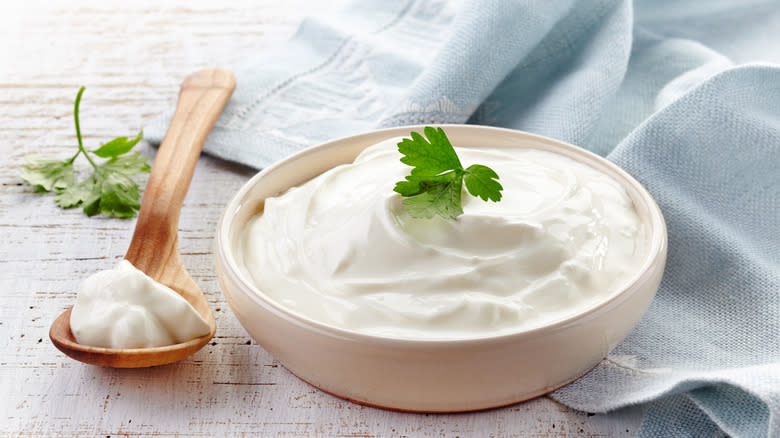 sour cream with cilantro garnish