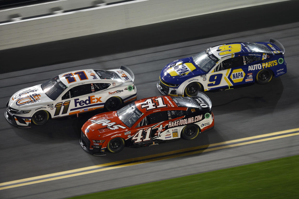 DAYTONA BEACH, FLORIDA - FEBRUARY 16: Denny Hamlin, driver of the #11 FedEx 50 Toyota, Ryan Preece, driver of the #41 HaasTooling.com Ford, and Chase Elliott, driver of the #9 NAPA Auto Parts Chevrolet, race during the NASCAR Cup Series Bluegreen Vacations Duel #2 at Daytona International Speedway on February 16, 2023 in Daytona Beach, Florida ahead of the Daytona 500. (Photo by Jared C. Tilton/Getty Images)