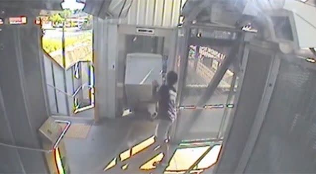 The man appears to struggle getting the fridge in the elevator. Photo: Facebook / Queensland Rail