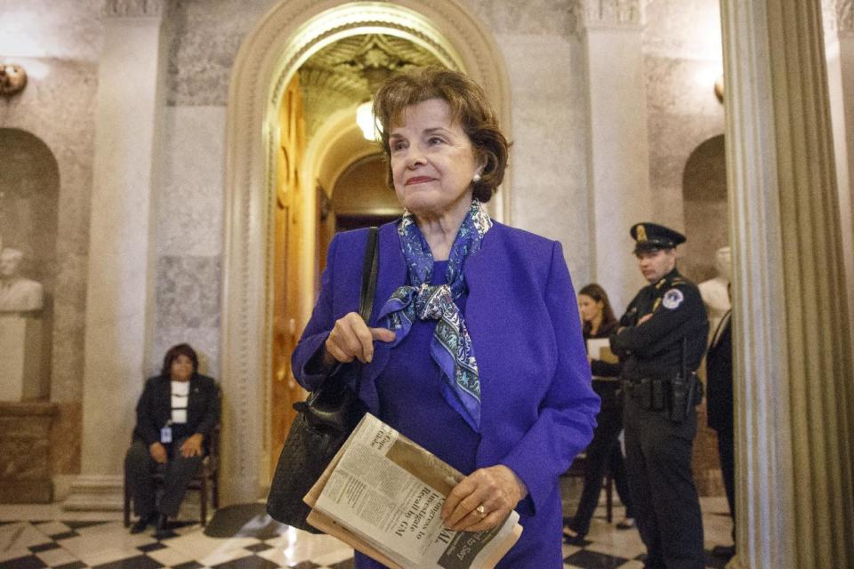 In this March 11, 2014, photo, Sen. Dianne Feinstein, D-Calif., chair of the Senate Intelligence Committee, leaves the chamber just after saying that the CIA's improper search of a stand-alone computer network established for Congress has been referred to the Justice Department, at the Capitol in Washington. A dispute between the CIA and the Senate that flared into public view this week has no obvious path toward criminal prosecution and may be better resolved through political compromise than in a court system leery of stepping into government quarrels, legal experts say. (AP Photo/J. Scott Applewhite)