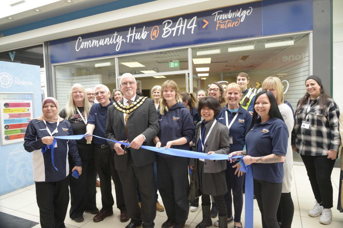 Trowbridge Mayor Cllr Stephen Cooper officially opens the Trowbridge hub at The Shires with the staff. <i>(Image: Trevor Porter 77019-3)</i>