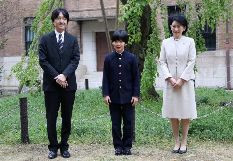 FILE PHOTO: Prince Hisahito, accompanied by his parents Prince Akishino and Princess Kiko, poses for photos at Ochanomizu University junior high school before attending the entrance ceremony in Tokyo