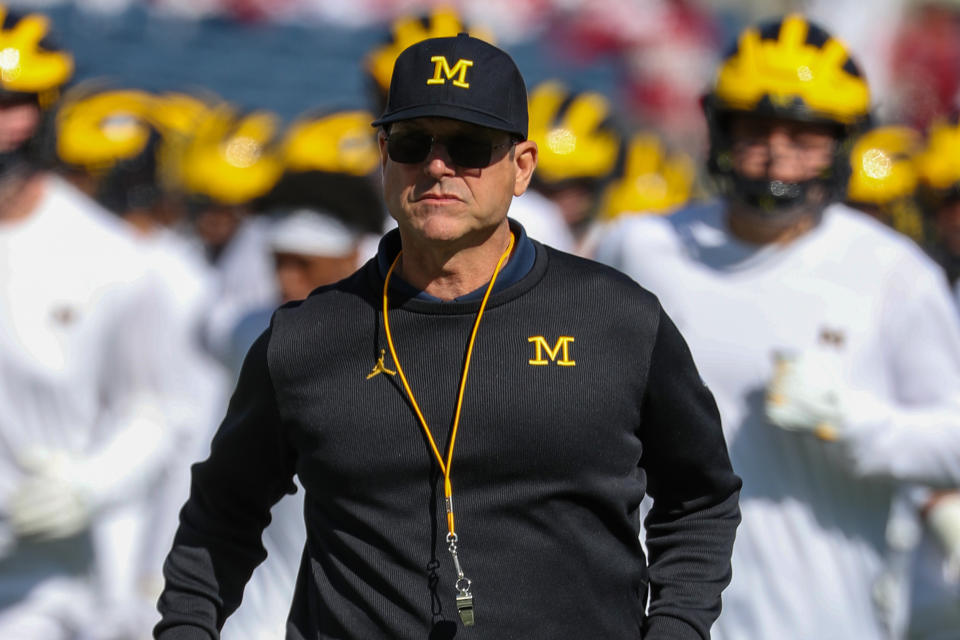 Michigan Wolverines head coach Jim Harbaugh runs off the field during warmups before a game on Jan. 1, 2020. (Joe Petro/Icon Sportswire via Getty Images)