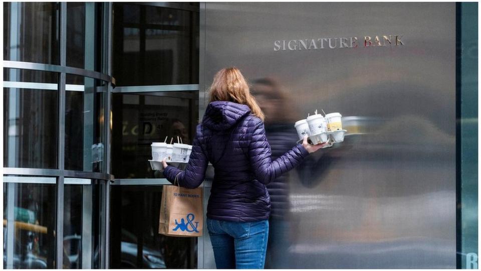 A worker arrives to the Signature Bank headquarters in New York City, U.S., March 12, 2023. REUTERS/Eduardo Munoz