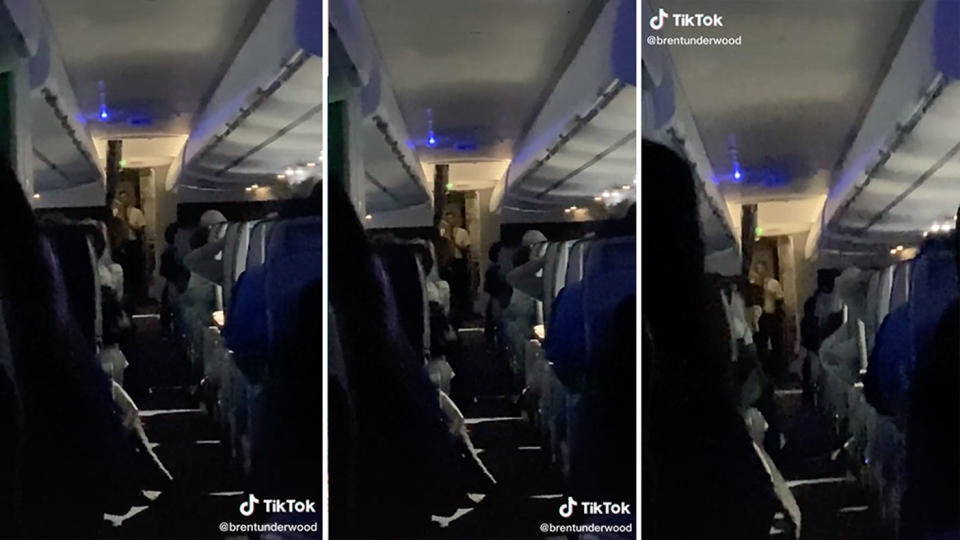 Stills from a video of a flight attendant calling out rude passengers on an American Airlines plane.