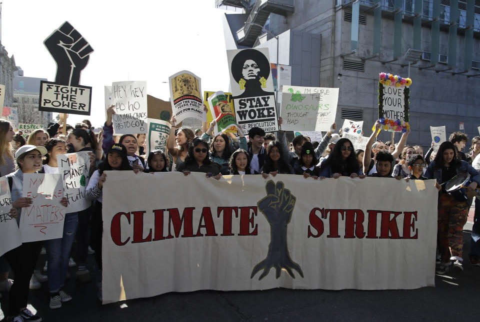 Students march onto Market Street during a protest against climate change Friday, March 15, 2019, in San Francisco. From the South Pacific to the edge of the Arctic Circle, students are skipping classes to protest what they see as the failures of their governments to take tough action against global warming. (AP Photo/Ben Margot)
