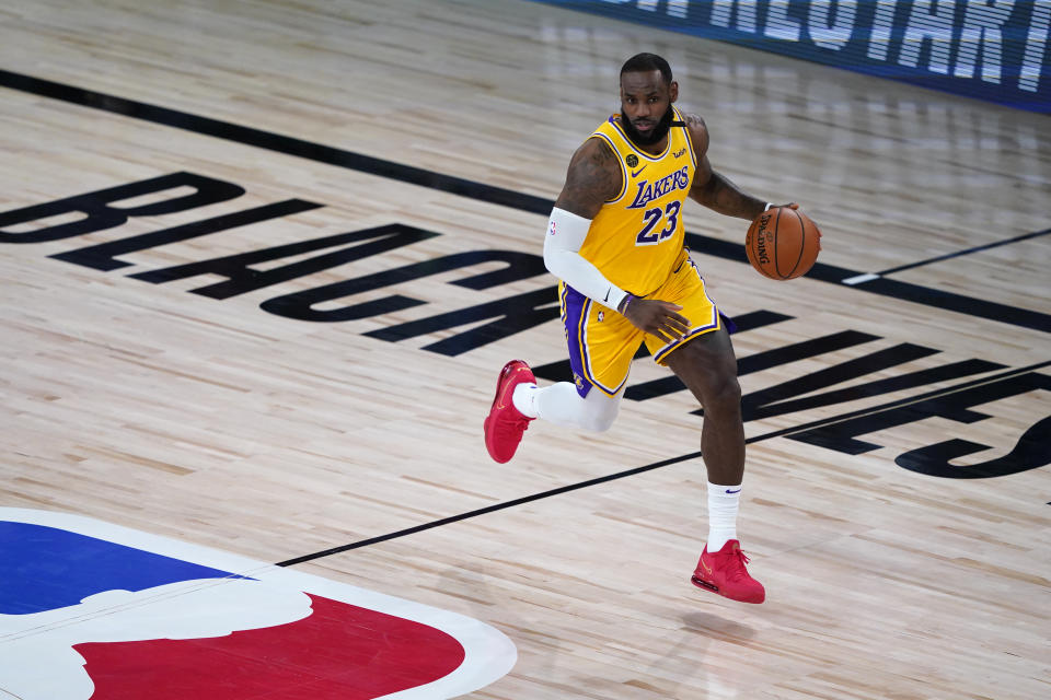 LAKE BUENA VISTA, FLORIDA - AUGUST 01: LeBron James #23 of the Los Angeles Lakers controls the ball during the first half of an NBA basketball game against the Toronto Raptors at The Arena in the ESPN Wide World Of Sports Complex on August 1, 2020 in Lake Buena Vista, Florida. NOTE TO USER: User expressly acknowledges and agrees that, by downloading and or using this photograph, User is consenting to the terms and conditions of the Getty Images License Agreement. (Photo by Ashley Landis - Pool/Getty Images)