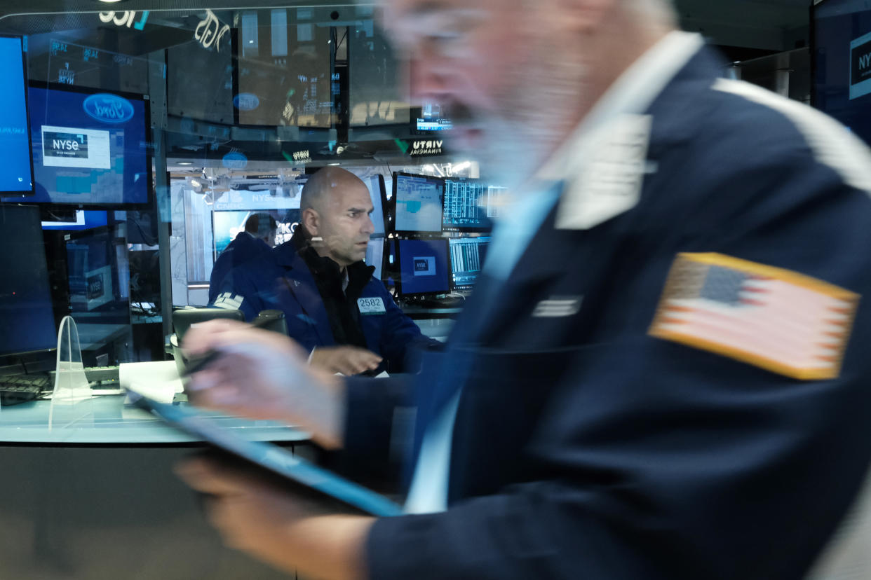 NEW YORK, NEW YORK - APRIL 28: Traders work on the floor of the New York Stock Exchange (NYSE) on April 28, 2022 in New York City.  The Dow Jones Industrial Average was up in morning trading as markets continued to move through a period of volatility over inflation concerns and the war in Ukraine.  (Photo by Spencer Platt/Getty Images)