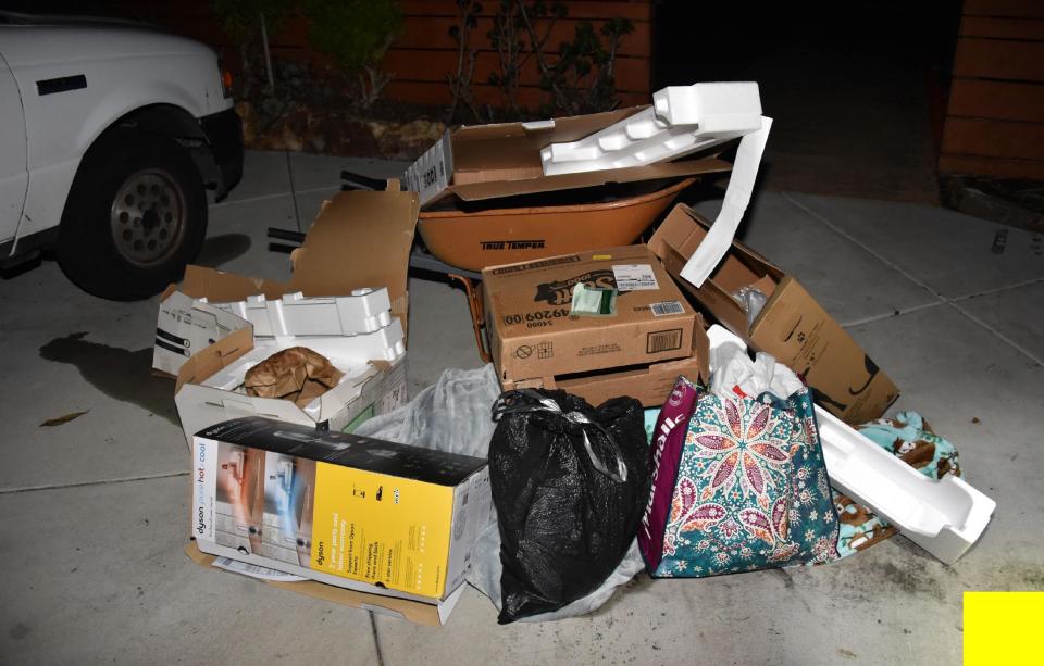 The pile of trash that investigators found in Tom Merriman's driveway when they came to investigate the phone call that he may have been killed. / Credit: San Diego Superior Court North County Division