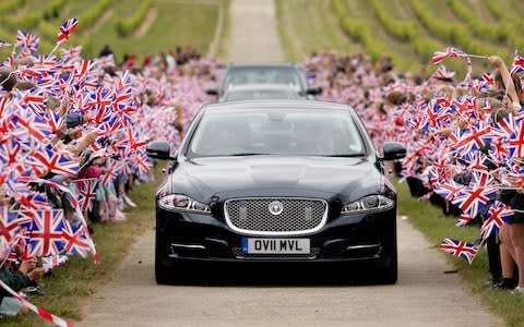 Jaguar car with UK flags - Credit: Getty