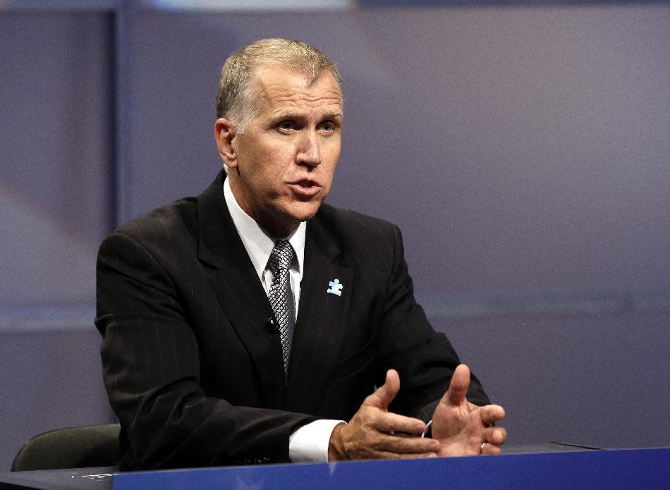 FILE - In this April 23, 2014, file photo, Republican senatorial candidate Thom Tillis responds during a televised debate at WRAL television studios in Raleigh, N.C. The struggle for control of the Republican Party is getting an early voter test in North Carolina, where former presidential nominee Mitt Romney and tea party favorite Rand Paul on Monday, May 5 pushed their own candidates for the right to challenge Democratic Sen. Kay Hagan in November.(AP Photo/Gerry Broome, Pool)