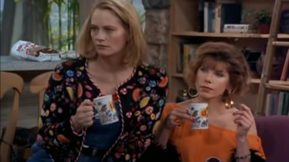 Cybill Shepherd and Christine Baranski having coffee while sitting on the sofa in Cybill.