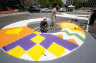 A giant mural reading "BLACK LIVES MATTER" is painted at Foley Square, Thursday, July 2, 2020, in the Manhattan borough of New York. (AP Photo/John Minchillo)