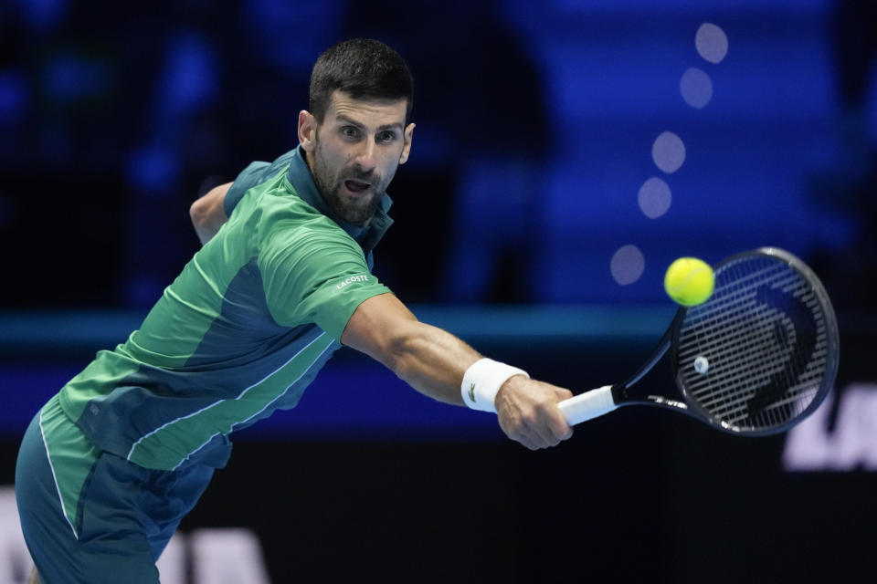 Serbia's Novak Djokovic returns the ball to Italy's Jannik Sinner during their singles final tennis match of the ATP World Tour Finals at the Pala Alpitour, in Turin, Italy, Sunday, Nov. 19, 2023. (AP Photo/Antonio Calanni)