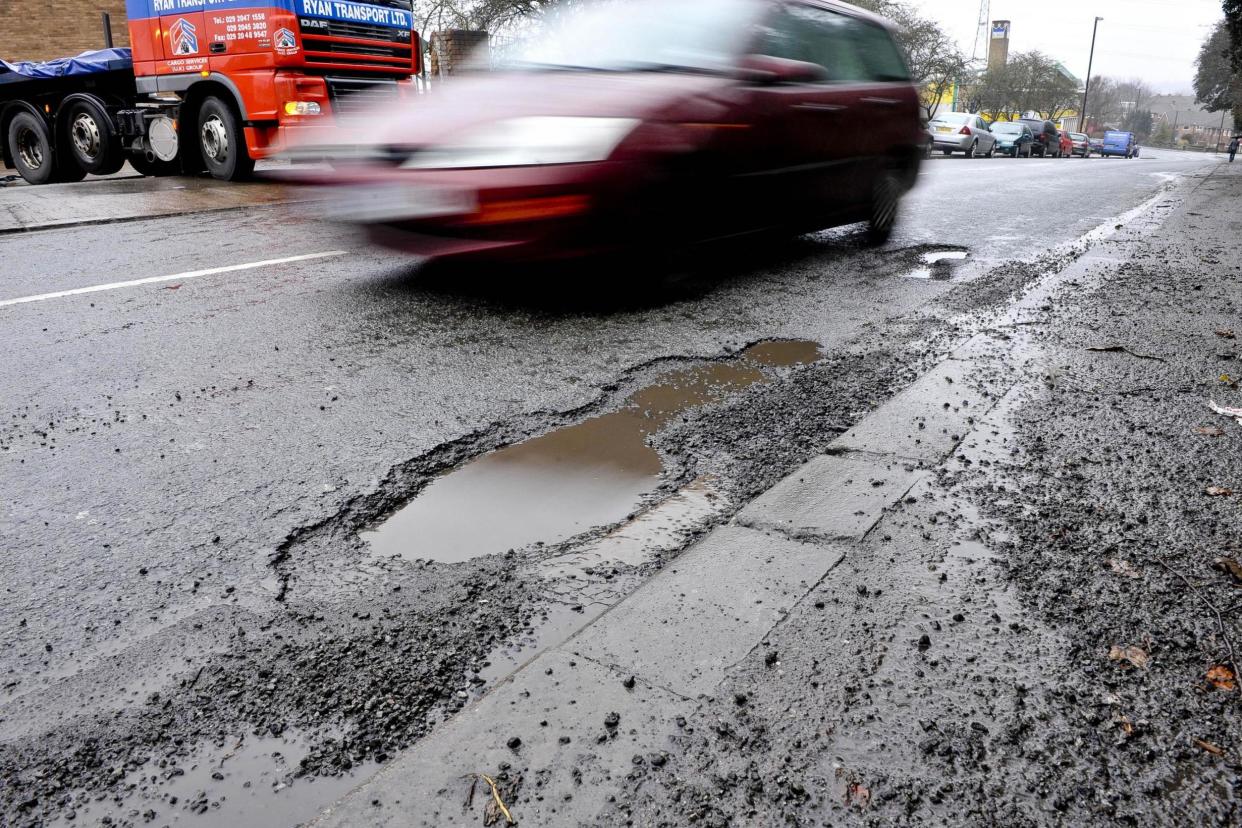 Cars on motorways of the future could be programmed to report potholes to nearly road maintainers: PA Wire/PA Images