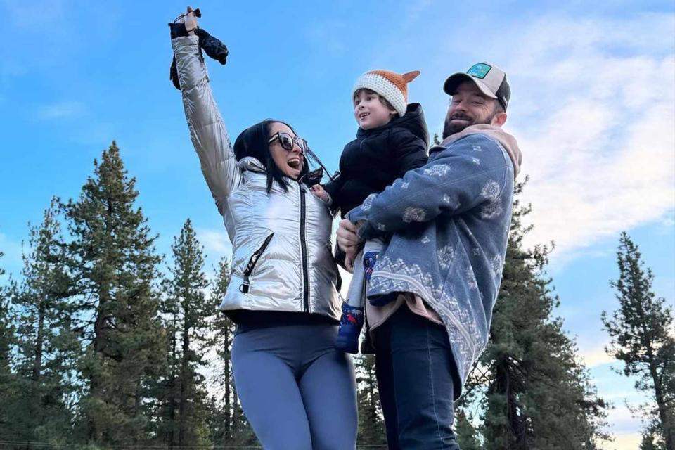 <p>Nikki Garcia/Instagram</p> Nikki Garcia and Artem Chigvintsev and their son