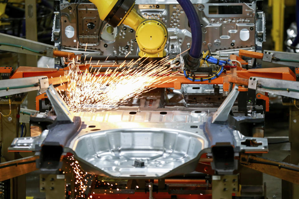 FILE - In this June 24, 2019, file photo machines work on a Ford vehicle assembly line at Ford's Chicago Assembly Plant in Chicago. American factories expanded at a faster pace last month, continuing a rebound from the coronavirus recession. The Institute for Supply Management, an association of purchasing managers, reported Tuesday, Sept. 1, 2020, that its manufacturing index climbed to 56 in August from 54.2 in July. (AP Photo/Amr Alfiky, File)