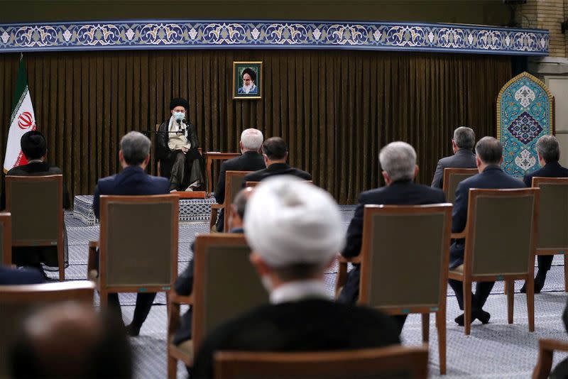 Iran's Supreme Leader Ayatollah Ali Khamenei meets with Iranian President Hassan Rouhani and his cabinet members, in Tehran