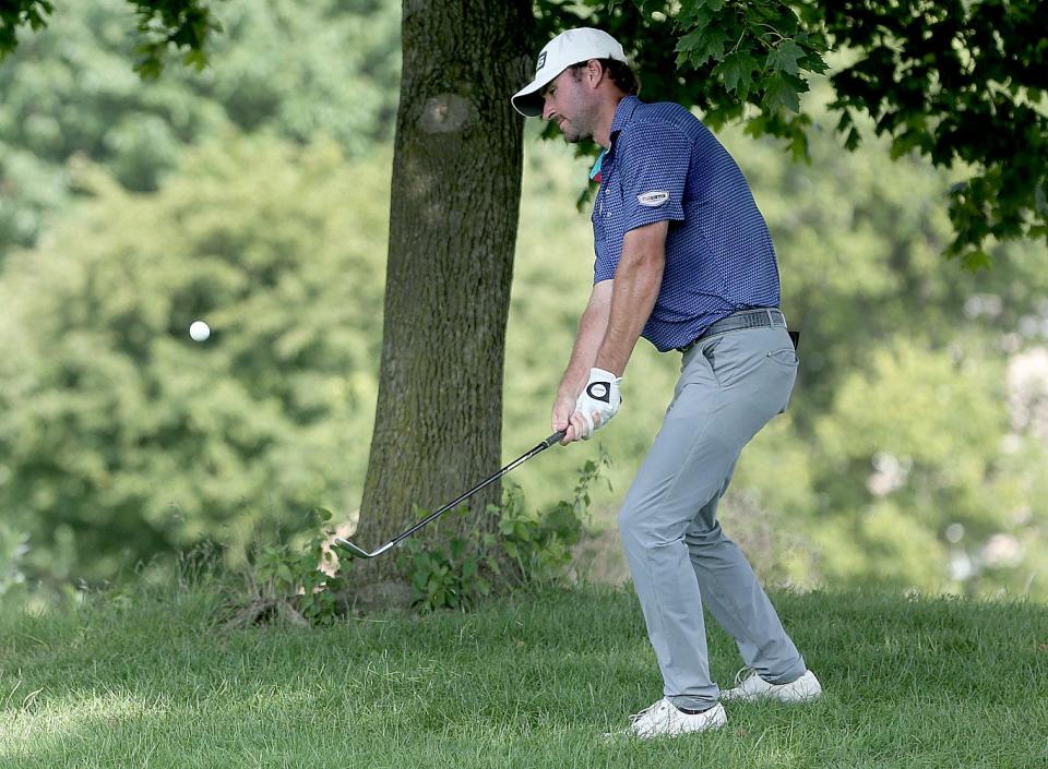 Austin Eckroat chips the ball onto the 15th green during the Korn Ferry Tour Memorial Health Championship Saturday July 16, 2022.