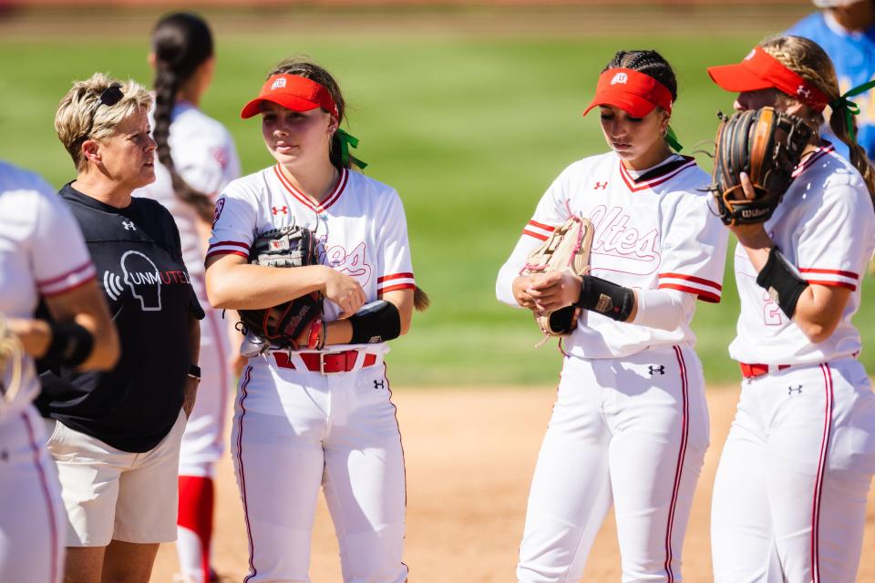 Utah head coach Amy Hogue huddles with her team during an NCAA softball game between Utah and UCLA at Dumke Family Softball Stadium in Salt Lake City on April 29, 2023. | Ryan Sun, Deseret News