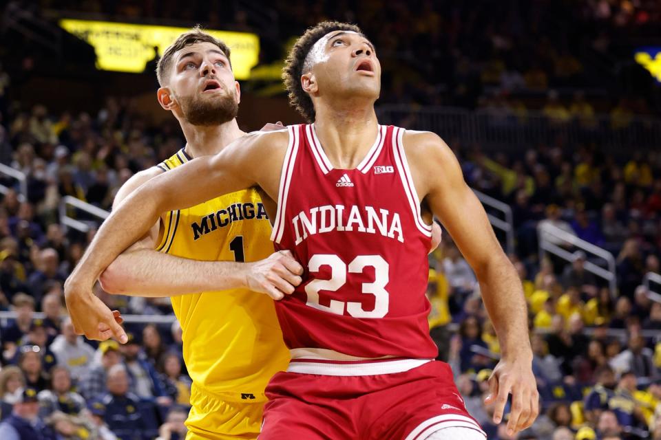Michigan center Hunter Dickinson and Indiana forward Trayce Jackson-Davis look for the rebound in the first half of U-M's 62-61 loss on Saturday, Feb. 11, 2023, at Crisler Center.