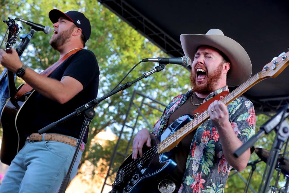 Justin Kirk, left the lead singer and Justyn Nolan the bass player perform during the first Friday Night Live Concert on the Square of the summer in Murfreesboro, on Friday, June 2, 2023. 