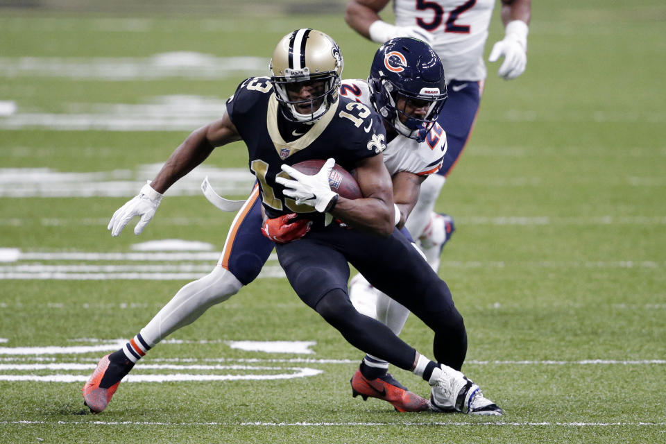 FILE - In this Sunday, Jan. 10, 2021 file photo, New Orleans Saints wide receiver Michael Thomas (13) carries against Chicago Bears cornerback Kindle Vildor (22) in the first half of an NFL wild-card playoff football game in New Orleans. Saints coach Sean Payton says Michael Thomas' ankle surgery should have been performed earlier than in June and apparently will force the Saints to play some games without the star receiver. But Payton is declining to assign blame for delays in Thomas' return to the field. Payton spoke Wednesday July 28, 2021 during his traditional interview session on the eve of the first practice of training camp.(AP Photo/Butch Dill, File)