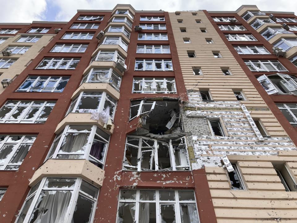 Broken glass is seen at a war-damaged apartment in Irpin, Ukraine, on Monday, April 11, 2022. Heartened by Russia’s withdrawal from the capital region, some residents have been coming to what’s left of home. (AP Photo/Cara Anna)